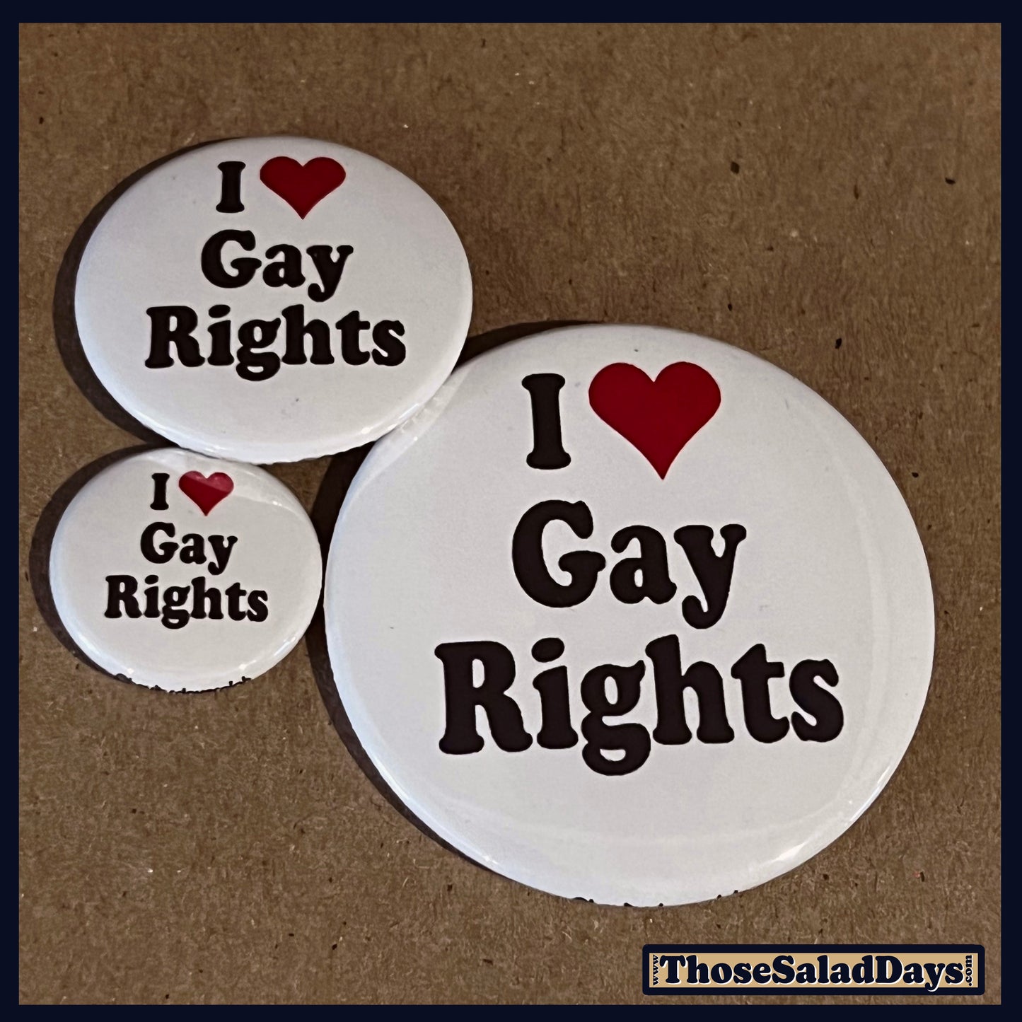 Three buttons of a Pro Gay Rights Message. One size is 1", 1.5" and 2.25".