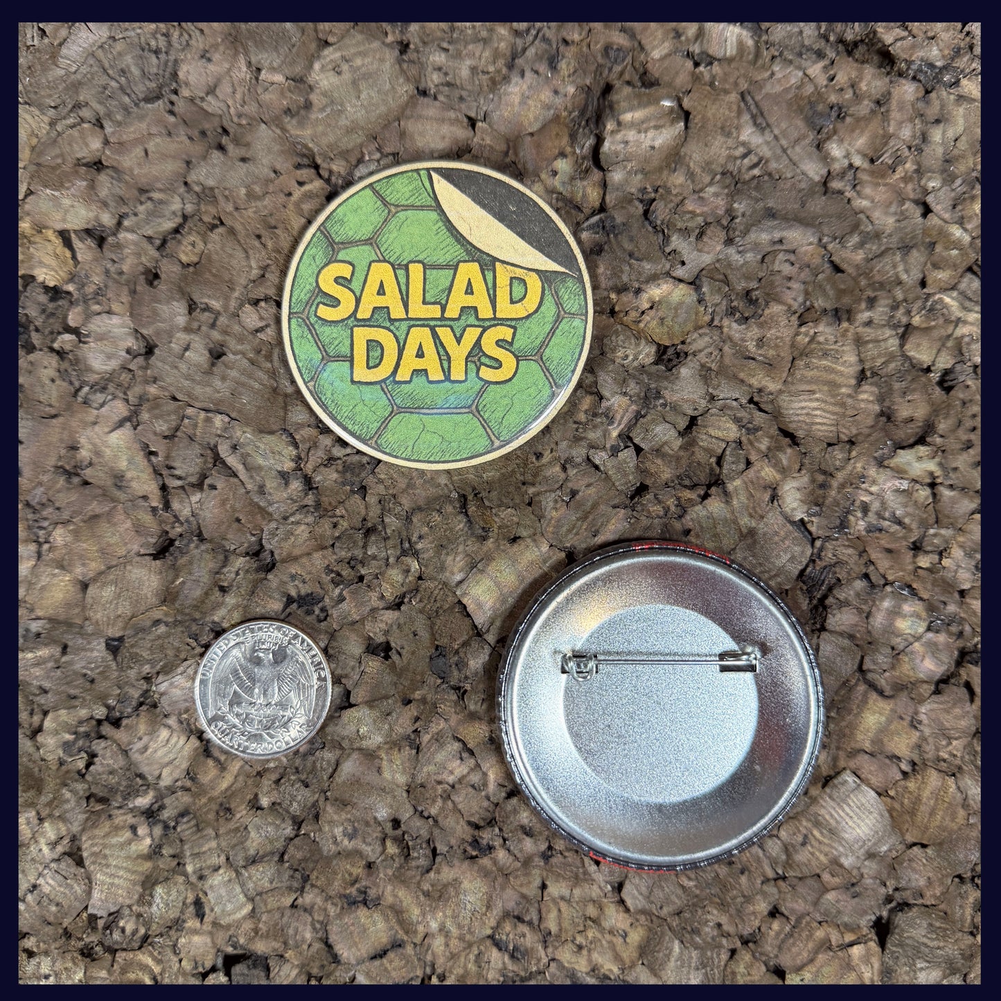 Two buttons on a textured surface with a quarter for scale. Showing the size of the button is 2.25 Inches.