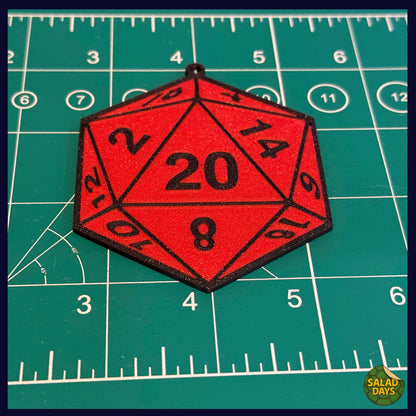 Red polyhedral die with numbers on a green grid background