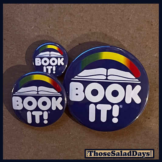 Three 'BOOK IT!' buttons with rainbow arches on a brown background