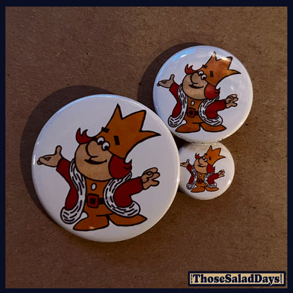 Three circular buttons featuring cartoon characters on a brown background.