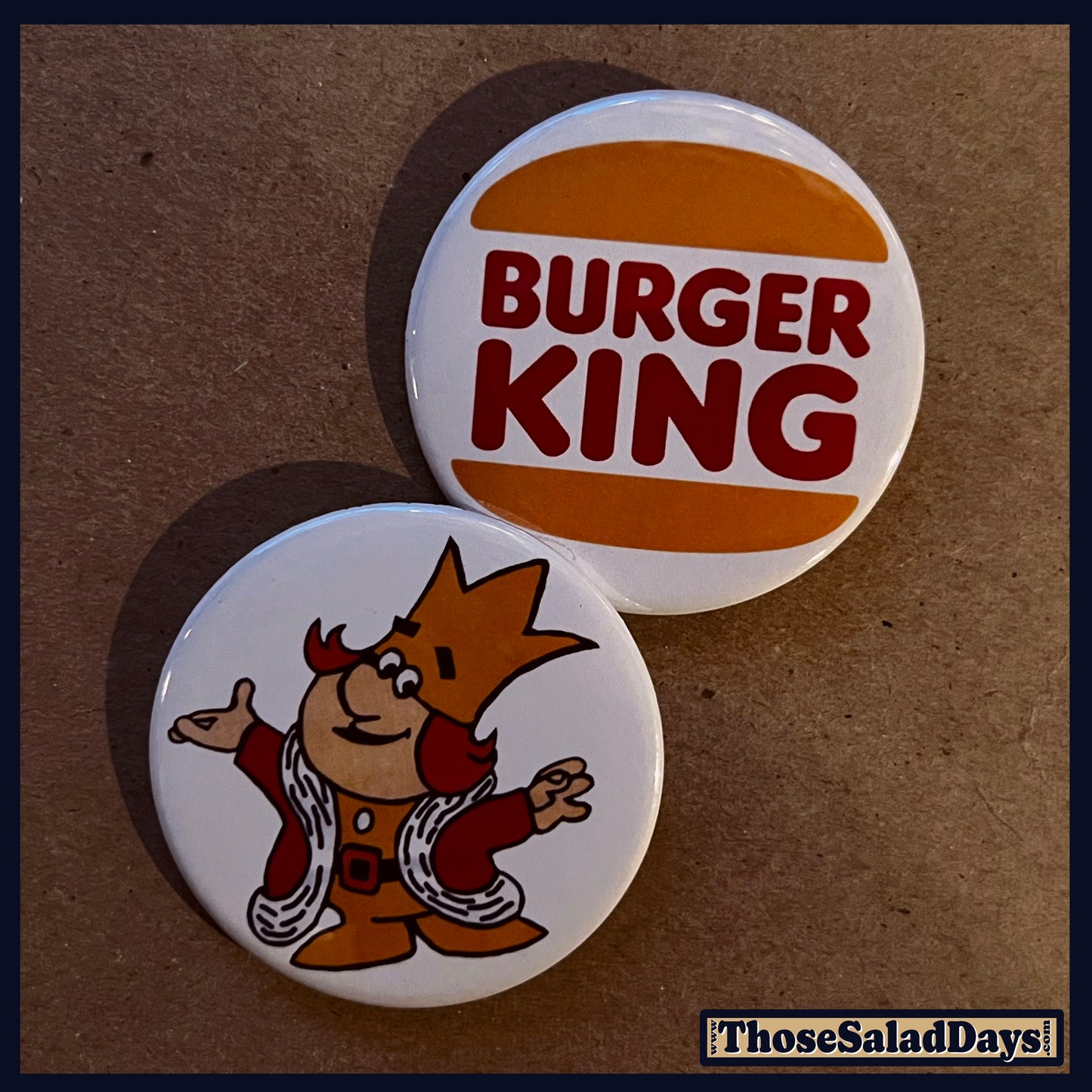 Two buttons featuring 'Burger King' and a cartoon character on a brown background.