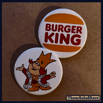 Two buttons featuring 'Burger King' and a cartoon character on a brown background.