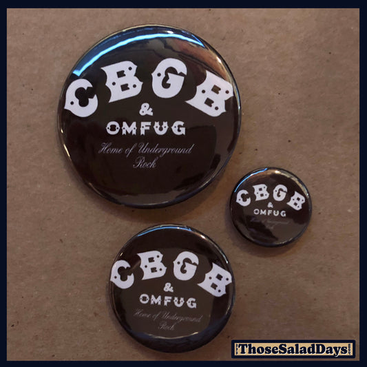 Three CBGB & OMFUG buttons on a brown background