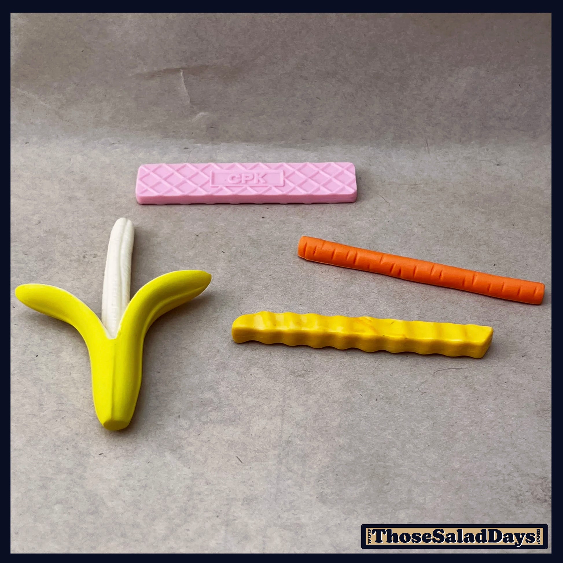 Colorful plastic tools on a gray background with 'ThoseSaladDays' branding.