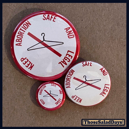 Set of buttons with pro-choice message on a brown background