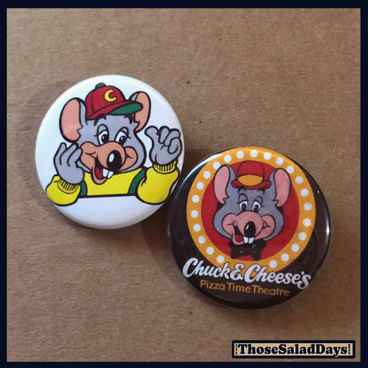 Two buttons featuring cartoon mouse characters on a brown background