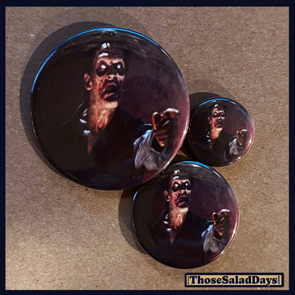 Three buttons of an Evil Dead type image. One size is 1", 1.5" and 2.25".