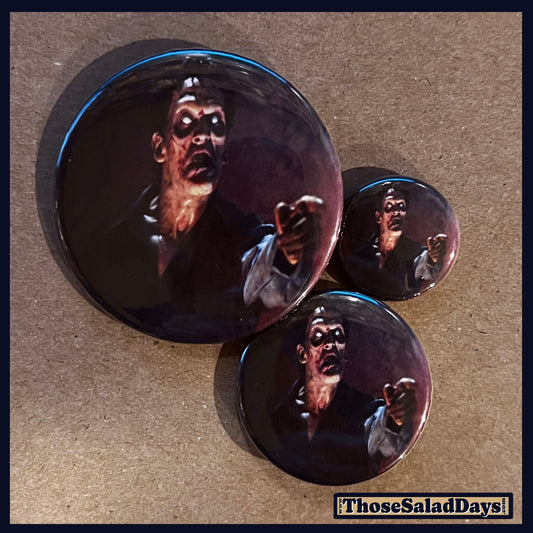 Three buttons of an Evil Dead type image. One size is 1", 1.5" and 2.25".