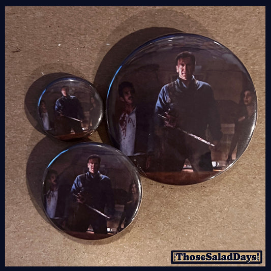 Three buttons of an Evil Dead type image. One size is 1", 1.5" and 2.25".