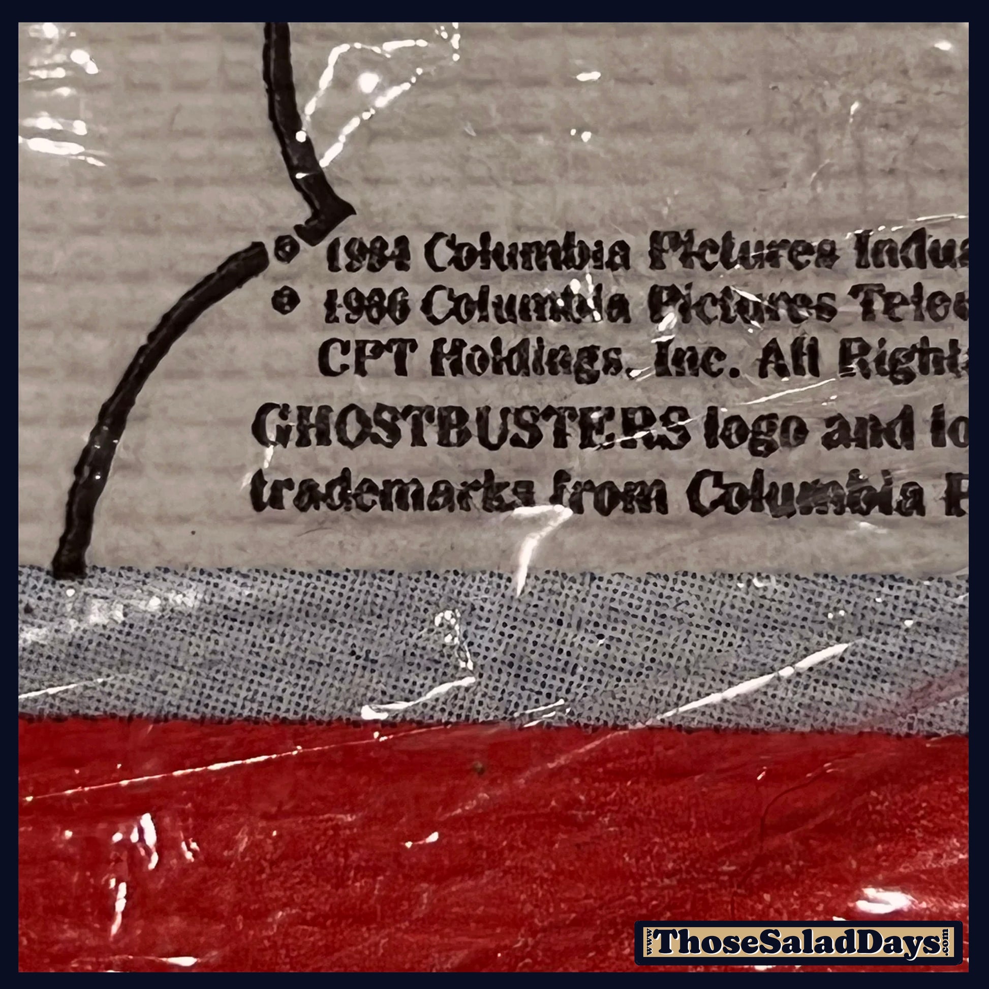 Credence text on a textured surface with a red and gray background