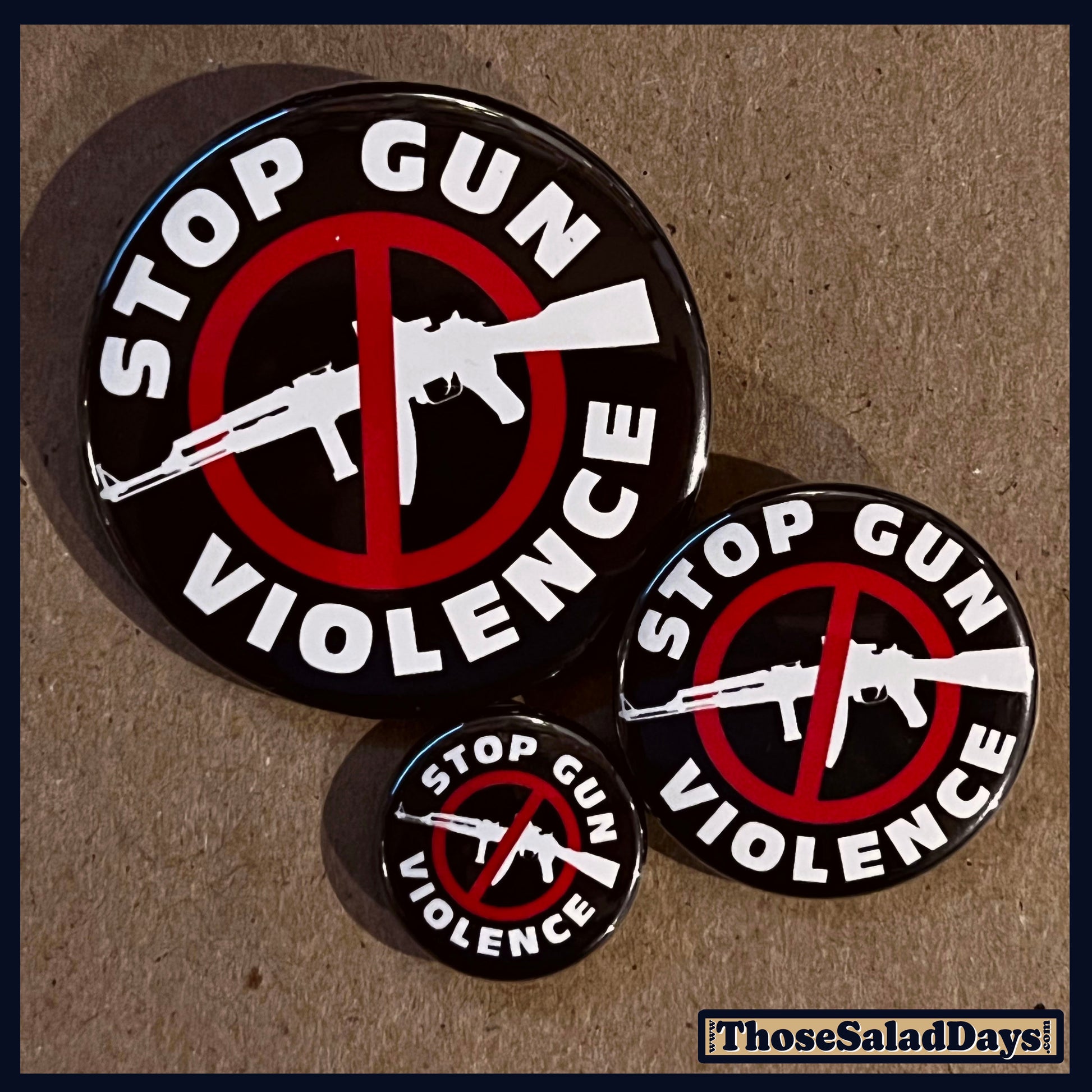 Three buttons of a Gun Reform Message. One size is 1", 1.5" and 2.25".
