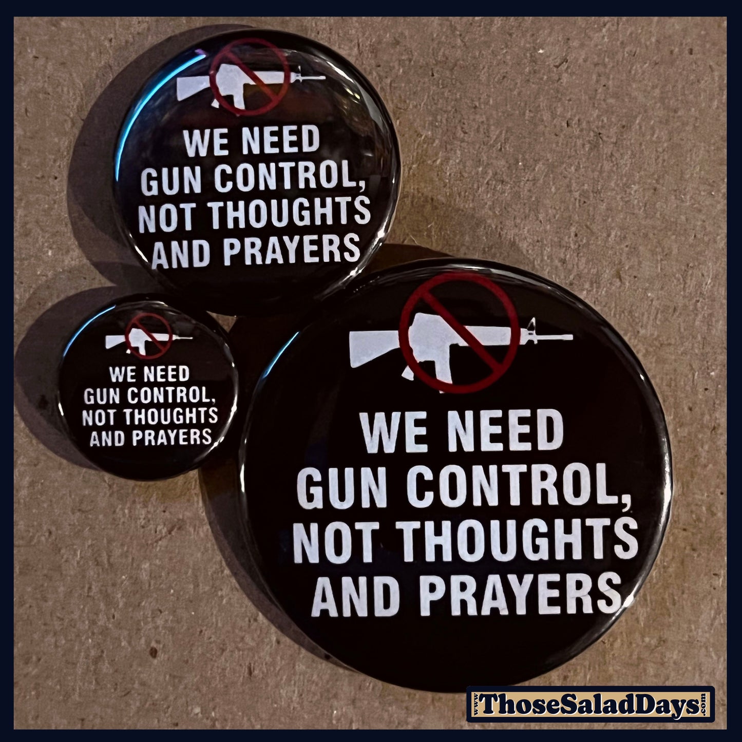 Three buttons of a Gun Reform Message. One size is 1", 1.5" and 2.25".