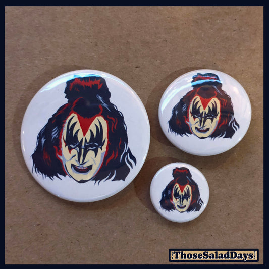 Three buttons of Artistic KISS. One size is 1", 1.5" and 2.25".