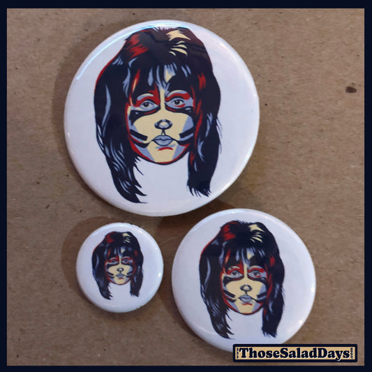 Three buttons of Artistic KISS. One size is 1", 1.5" and 2.25".