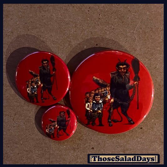 Three buttons of a Krampus Image. One size is 1", 1.5" and 2.25".