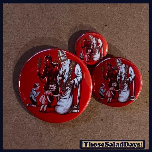 Three buttons of a Krampus Image. One size is 1", 1.5" and 2.25".