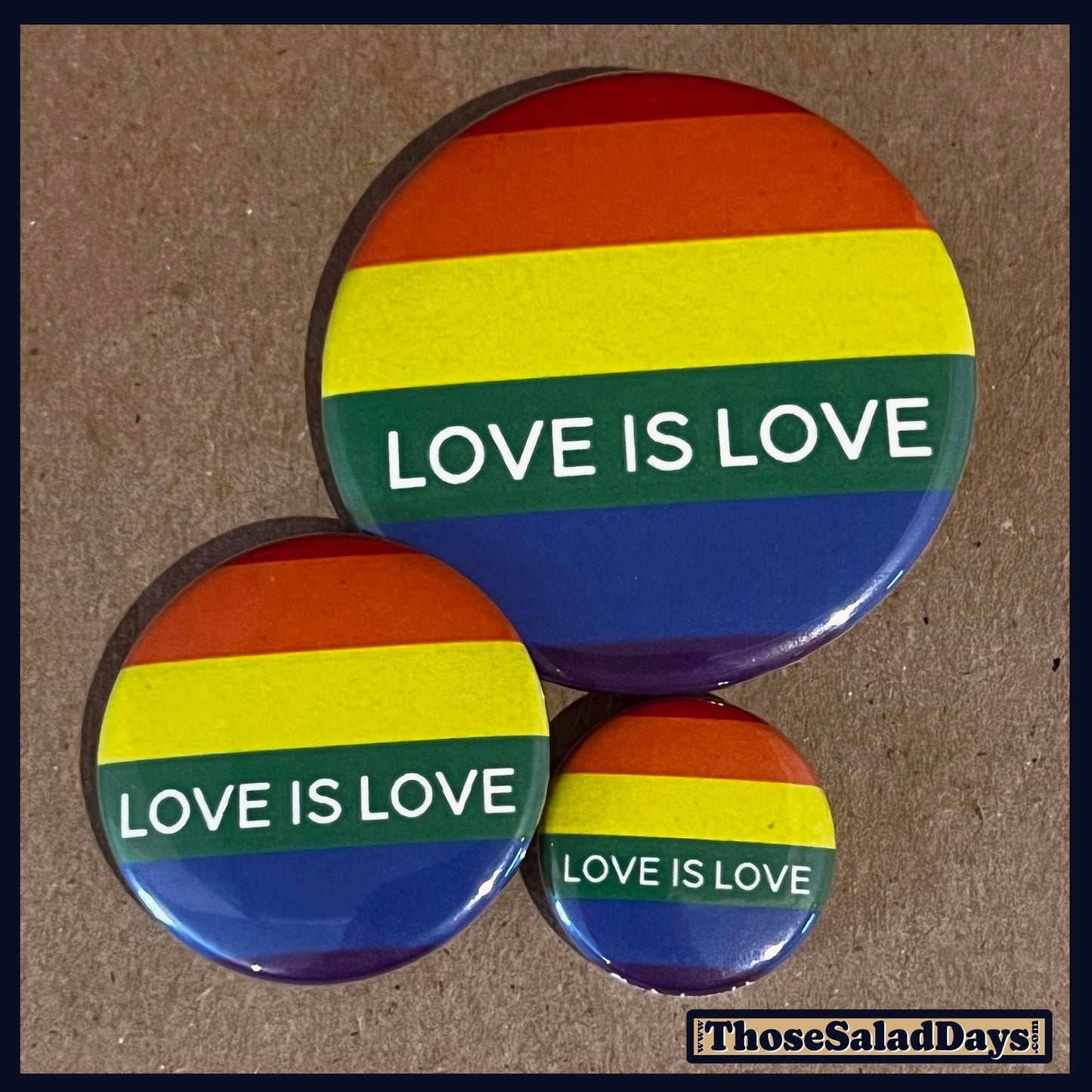Three buttons of a Pro Gay Rights Message. One size is 1", 1.5" and 2.25".