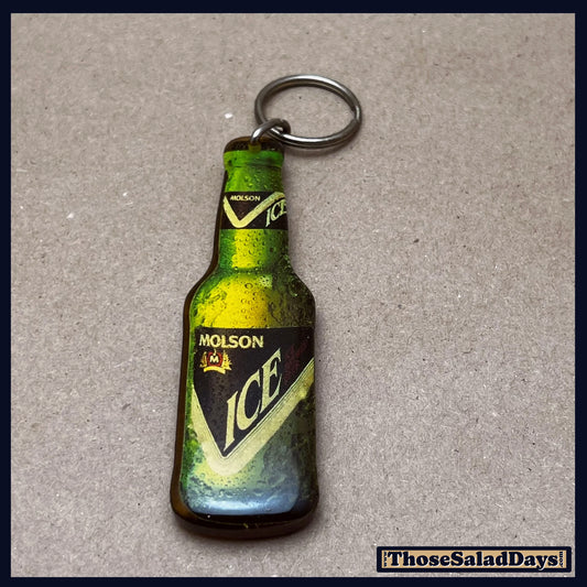 Molson Ice bottle-shaped keychain on a gray background