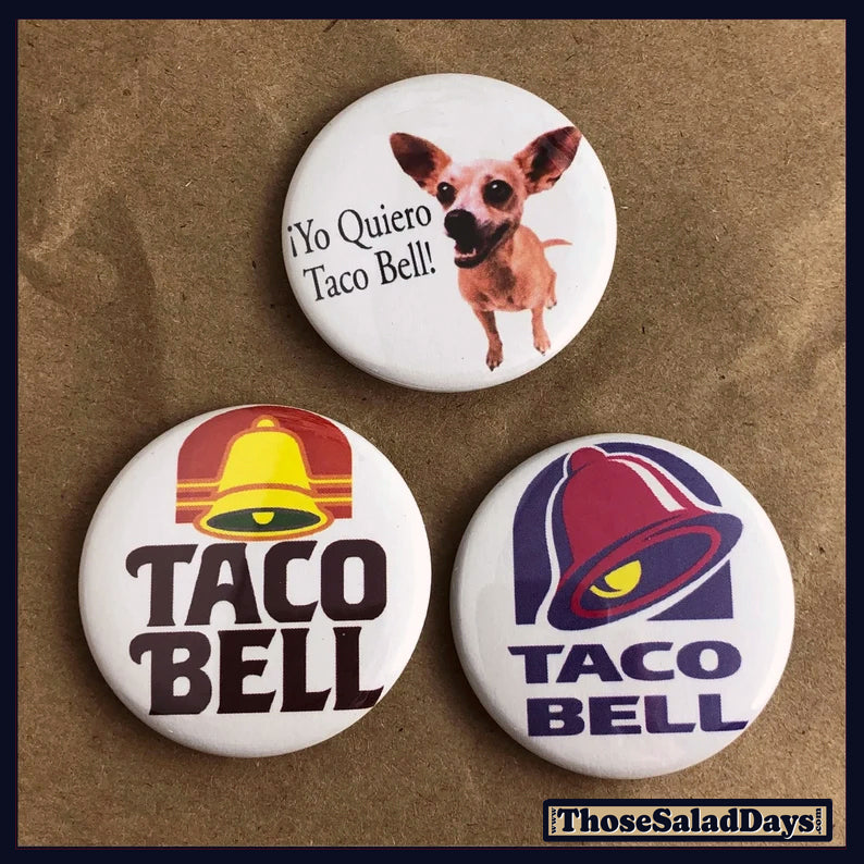 Three Taco Bell buttons on a brown background